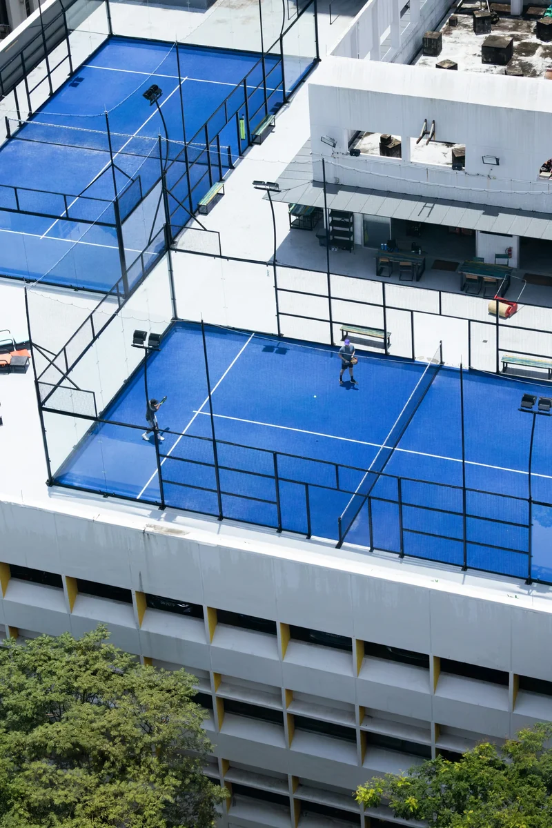 A blue rooftop padel court